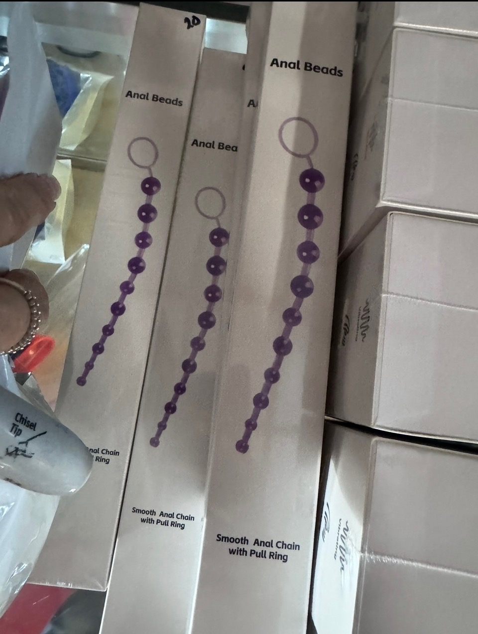 Purple anal beads in retail packaging