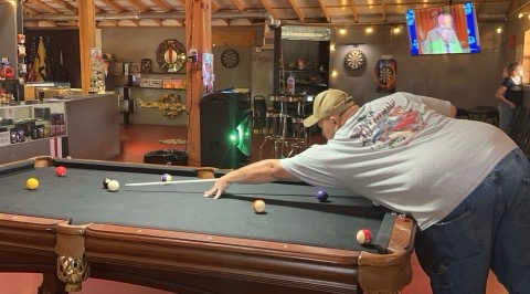 A player lining up a shot inside Eagle Rock Bar